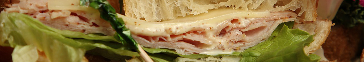 Eating Sandwich at Three Girls Bakery restaurant in Seattle, WA.